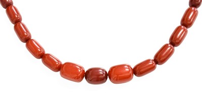 Lot 497 - A Graduated Amber Bead Necklace, length 84cm...