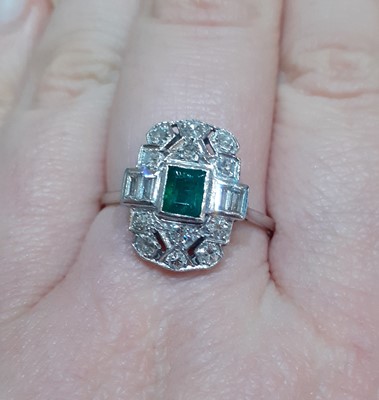 Lot 2054 - An Emerald and Diamond Ring the openwork...
