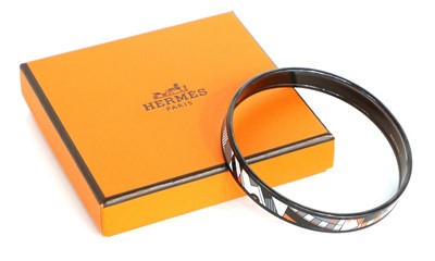 Lot 1098 - Hermés Enamel Bangle printed in white, grey,...