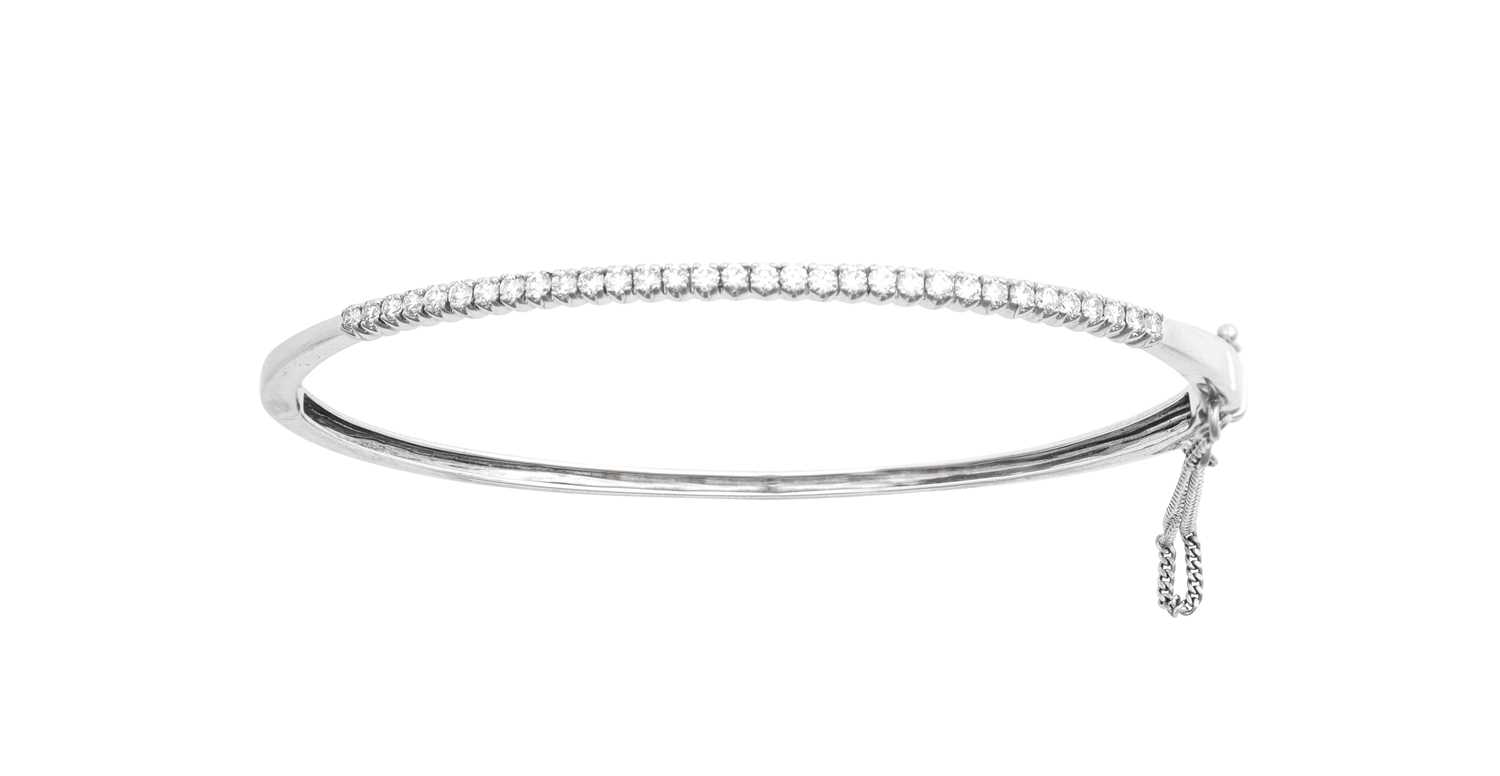 Lot 2025 - An 18 Carat White Gold Diamond Bangle the...