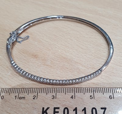 Lot 2025 - An 18 Carat White Gold Diamond Bangle the...