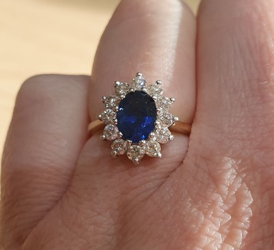 Lot 2125 - An 18 Carat Gold Sapphire and Diamond Cluster...