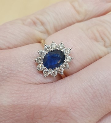 Lot 2125 - An 18 Carat Gold Sapphire and Diamond Cluster...