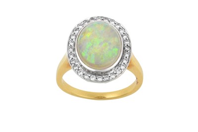 Lot 2056 - An Opal and Diamond Cluster Ring the oval...