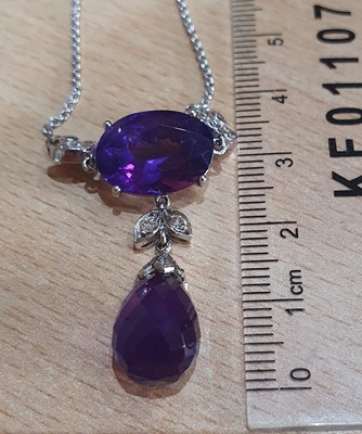 Lot 2046 - An Amethyst and Diamond Necklace the oval cut...