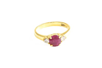 Lot 578 - A Ruby and Diamond Three Stone Ring, the round...