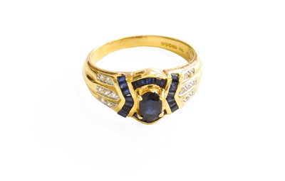 Lot 566 - An 18 Carat Gold Sapphire and Diamond Cluster...