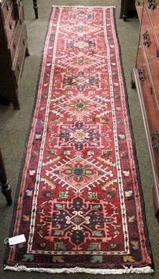 Lot 1165 - Narrow Karaja Runner, the brick red field with...