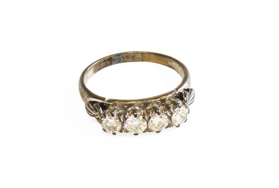 Lot 532 - A Diamond Four Stone Ring, the round brilliant...