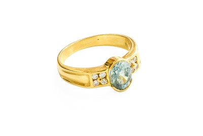 Lot 473 - A Blue Zircon and Diamond Ring, the oval cut...