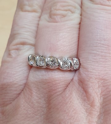 Lot 2006 - A Diamond Five Stone Ring the round brilliant...
