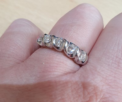 Lot 2006 - A Diamond Five Stone Ring the round brilliant...