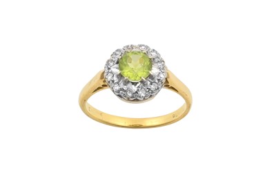 Lot 2145 - A Peridot and Diamond Cluster Ring the round...