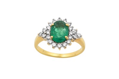 Lot 2159 - An Emerald and Diamond Cluster Ring the oval...