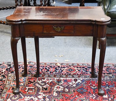 Lot 1456 - An 18th Century Mahogany Foldover Table