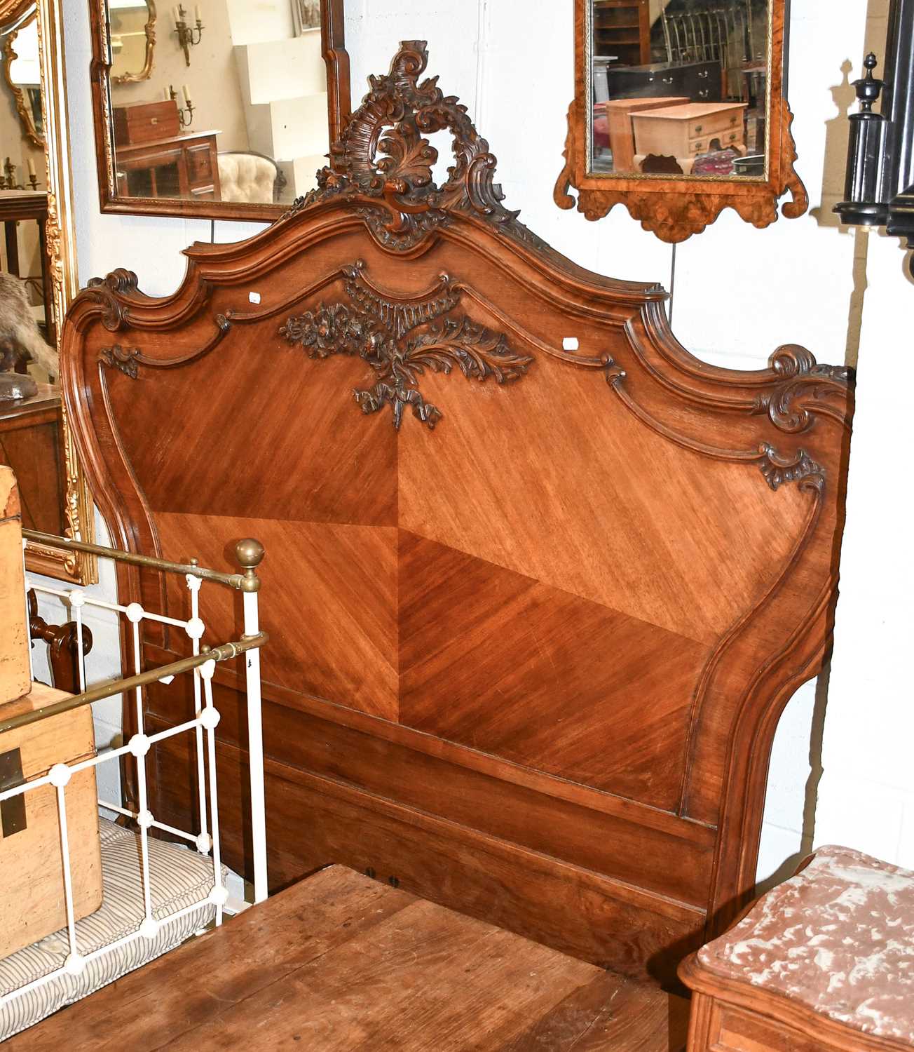 Lot 1245 - A French Walnut Carved Double Bed, late 19th...