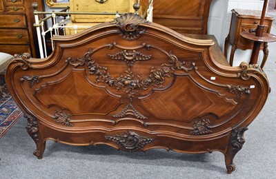 Lot 1245 - A French Walnut Carved Double Bed, late 19th...