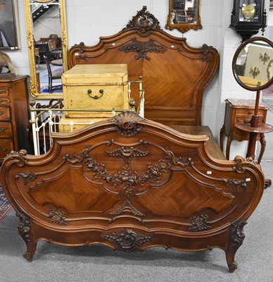 Lot 1245 - A French Walnut Carved Double Bed, late 19th...