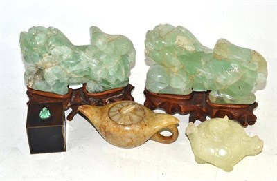 Lot 31 - A pair of Chinese green quartz dogs of fo, on wood stands; two carved softstone teapots and a...