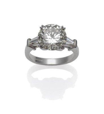 Lot 391 - A Platinum Diamond Ring, the round brilliant cut diamond in a white four claw setting, with a...