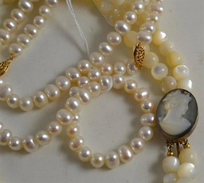 Lot 60 - A Baroque pearl necklace and bracelet, an Italian mother-of-pearl necklace with cameo clasp and...