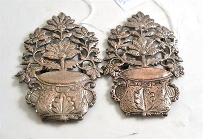Lot 61 - Two 19th century pierced and embossed silver buckles depicting a two handled vase of flowers,...