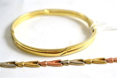 Lot 63 - A 9ct gold bangle and a 9ct three colour gold bracelet (a.f.) (2)