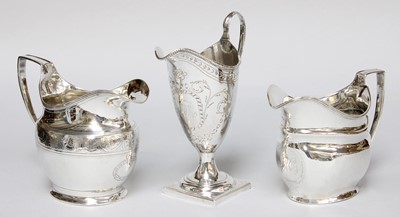 Lot 158 - Three George III Silver Cream-Jugs, two oval...