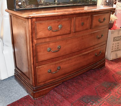 Lot 1261 - A Bow Fronted Cherry Wood Three Height Chest...