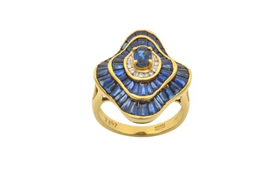 Lot 2158 - A Sapphire and Diamond Ring the central raised...
