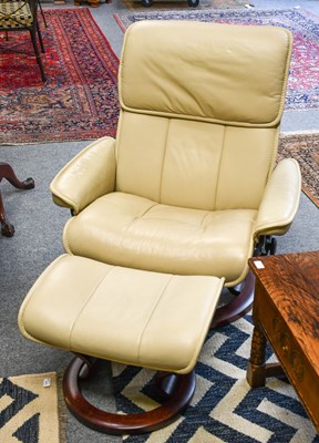 Lot 1270 - A Cream Leather Stressless Reclining Armchair,...