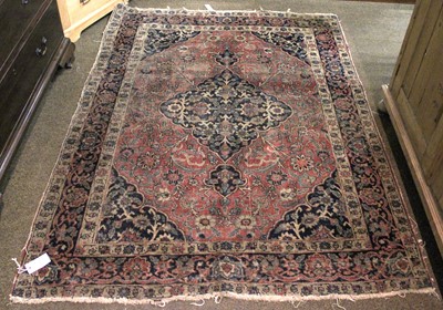 Lot 1171 - Tabriz Rug, the madder field of vines centred...