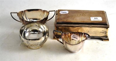 Lot 86 - Hinged silver mounted cigarette box, silver cream and sugar bowl, circular silver bowl (4)