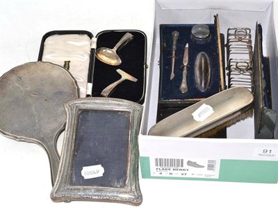 Lot 91 - Cased silver baby push and spoon, two cased silver manicure sets, two silver toast racks,...