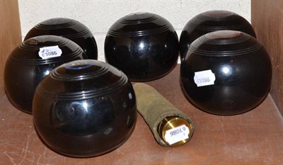 Lot 98 - A small four draw telescope and two crown green bowls and a set of four flat green bowls