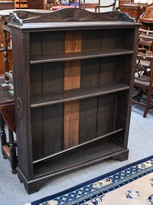 Lot 1426 - A Carved Oak Open Bookcase, with adjustable...