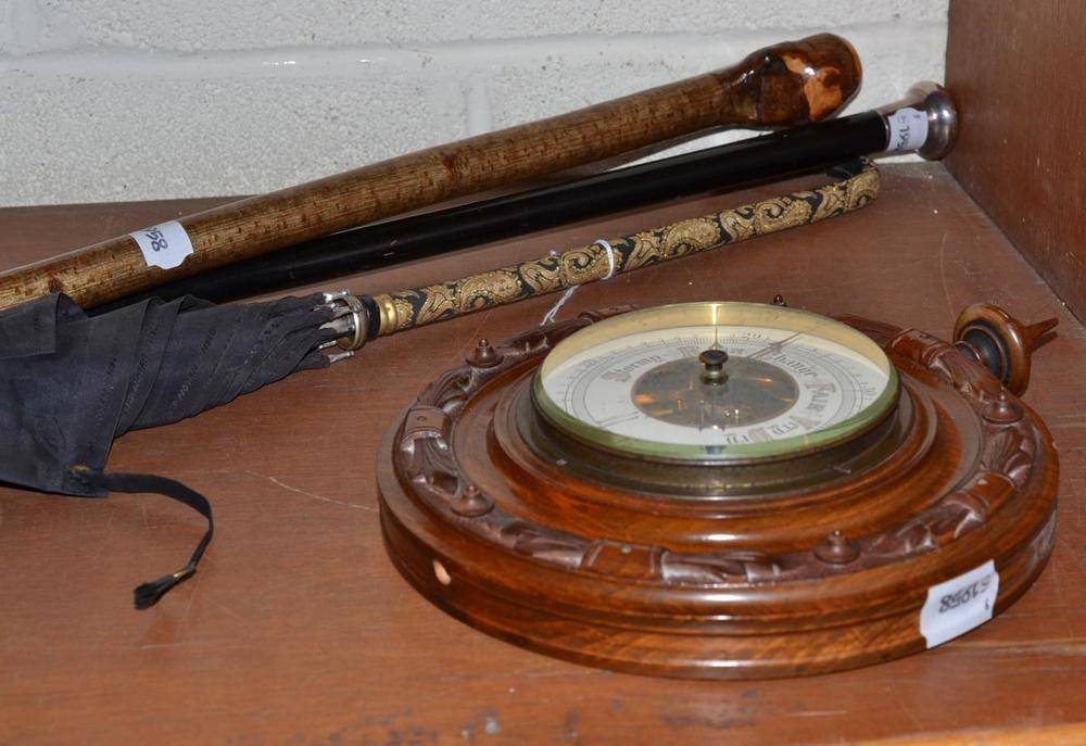 Lot 101 - An aneroid barometer, silver mounted stick, umbrella and a wooden stick