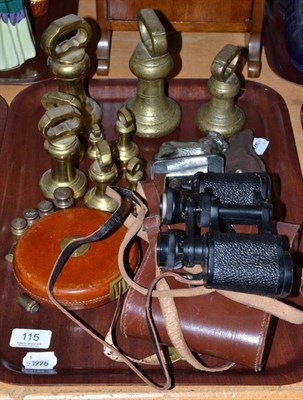 Lot 115 - Assorted brass weights, pair of binoculars in leather case, leather cased tape measure and...