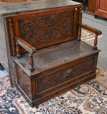 Lot 1295 - A 20th century carved Oak Monks Bench, 105cm...