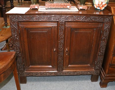 Lot 1392 - A Carved Oak Two Door Cabinet, 118cm by 41cm...