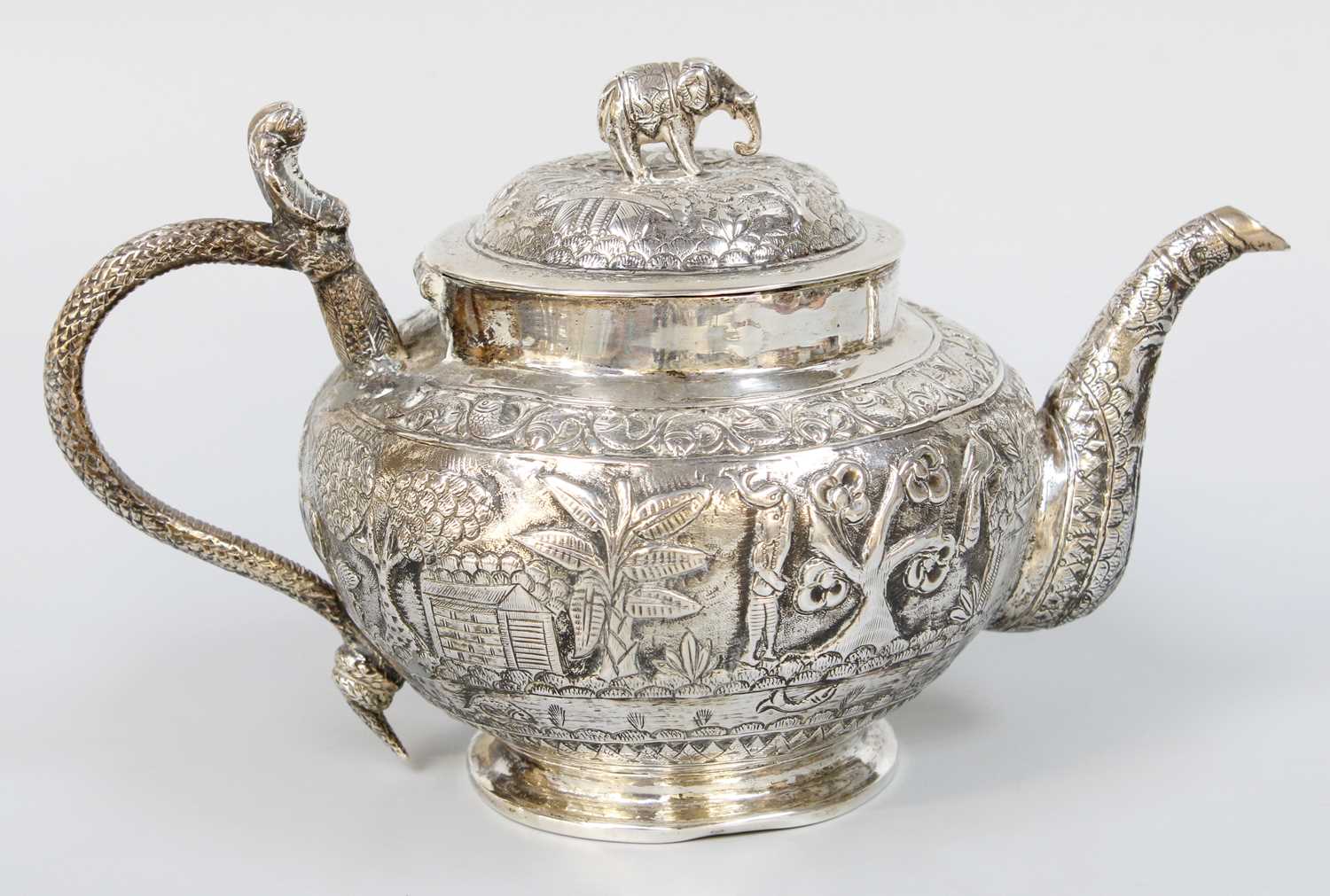 Lot 36 - An Indian or Burnese Silver Teapot, The Base...