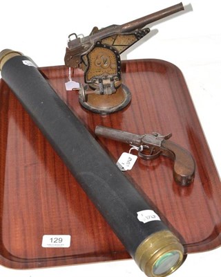 Lot 129 - A percussion pocket pistol, a telescope by Hughes of London and a model of a Howitzer