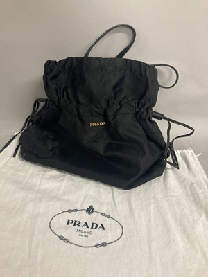 Lot 1088 - Prada Black Drawstring Tote Handbag, with gold-...