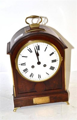Lot 131 - A mahogany striking mantel clock with a presentation plaque to the front