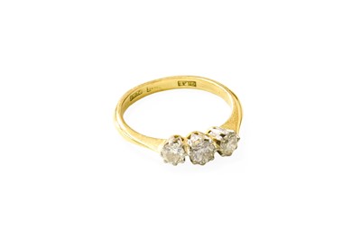 Lot 108 - A Diamond Three Stone Ring, the graduated...