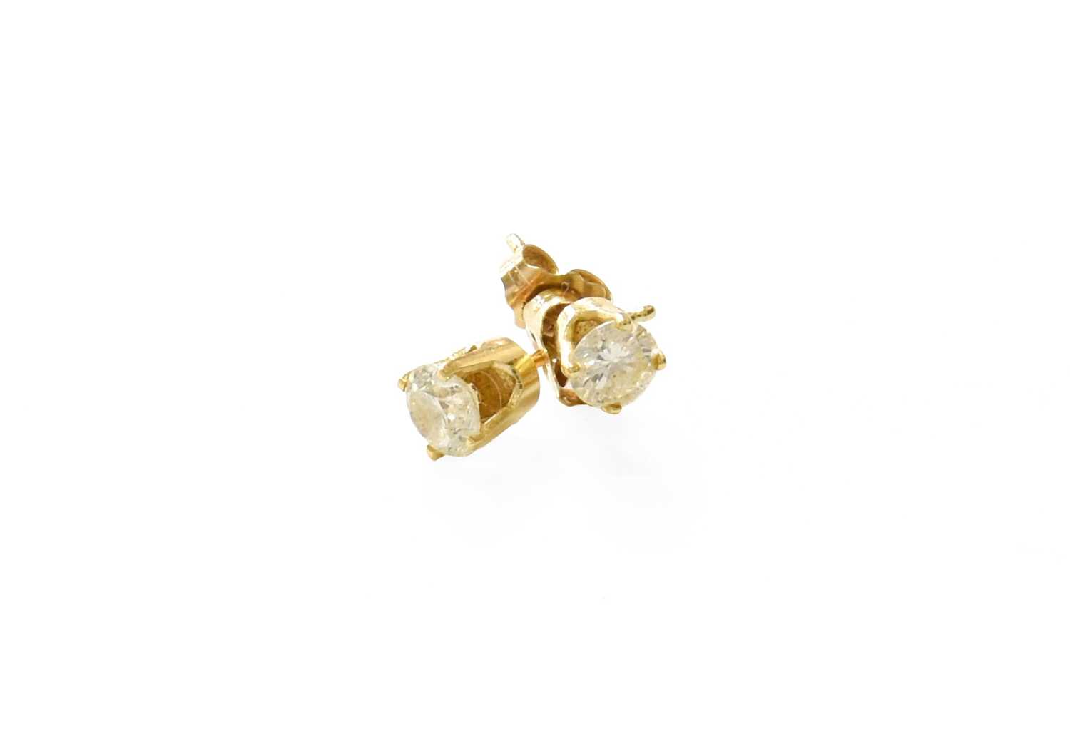 Lot 83 - A Pair of Diamond Solitaire Earrings, the...