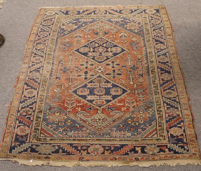 Lot 1262 - Early 20th Century Heriz Rug, the madder field...