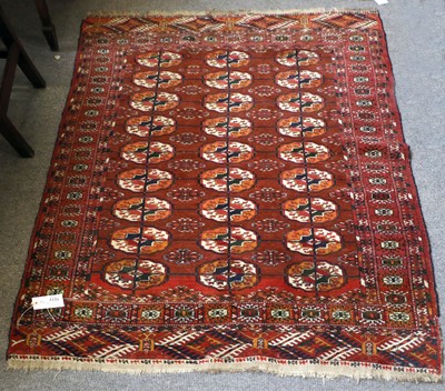 Lot 217 - Tekke Rug, the raspberry field with three...