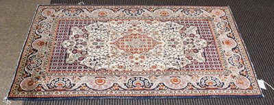 Lot 1014 - Kashmir Silk Rug, the ivory field centred by a...