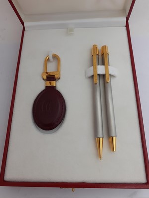 Lot 2239 - A Cased Must de Cartier Ball-Point Pen, Mechanical Pencil and Key-Ring